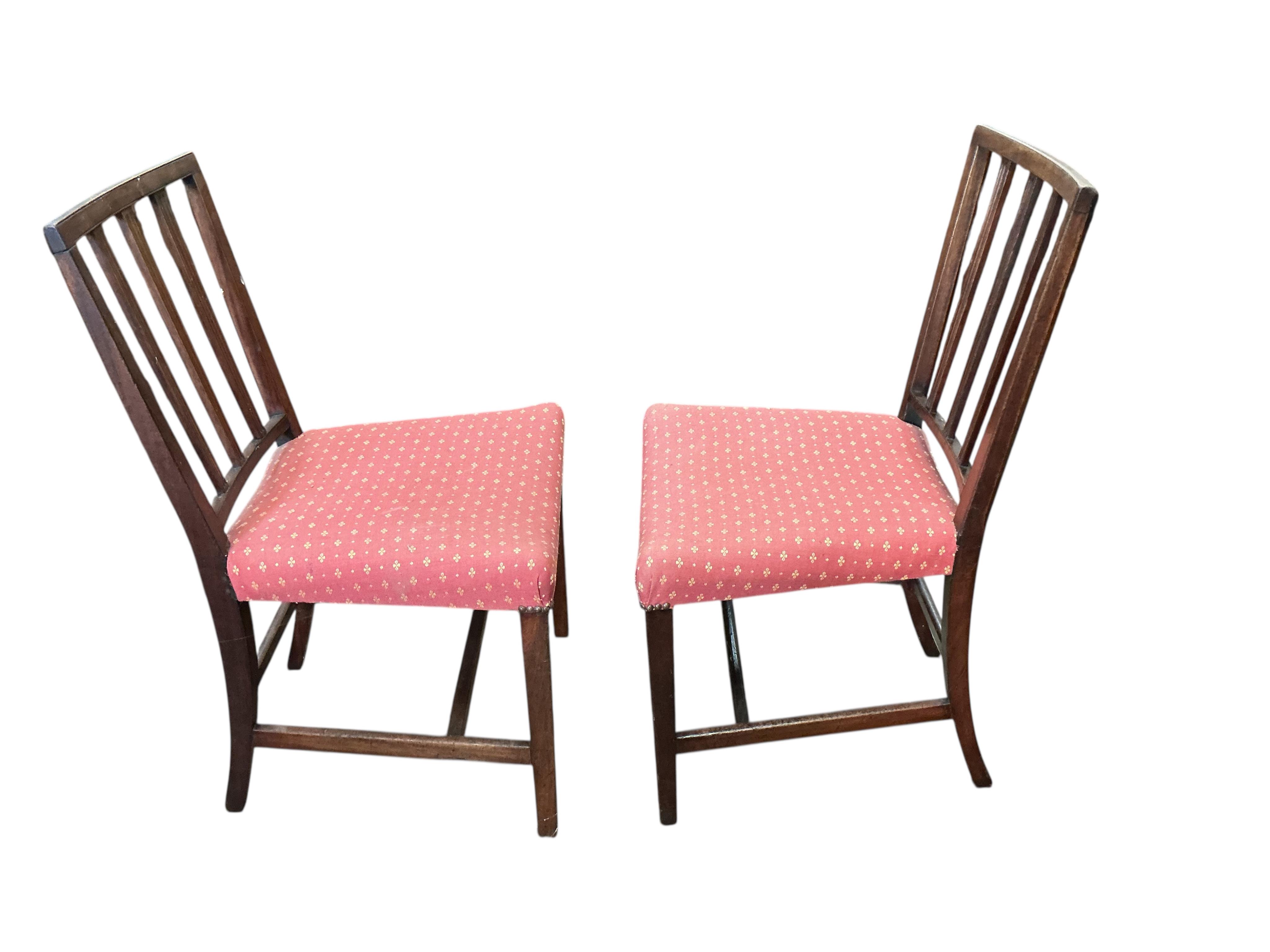 A set of four George III mahogany dining chairs